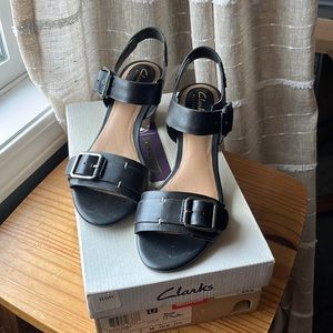 Brand new Clark’s size 7 black leather sandals